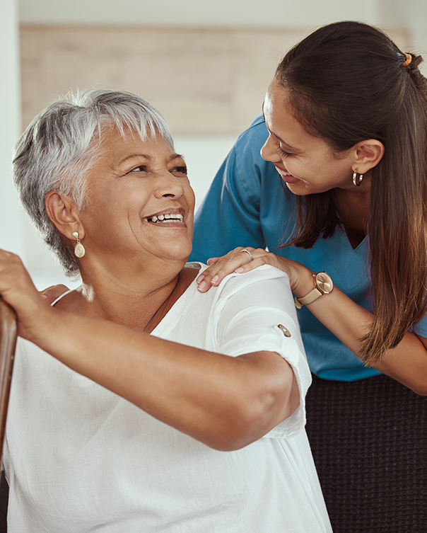 Smiling elderly woman and carer