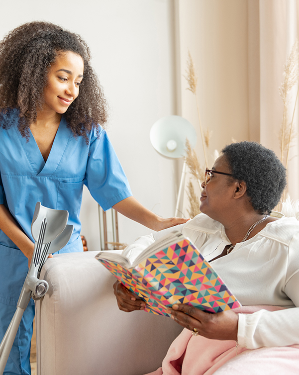 Young carer checking on older woman with disabilities